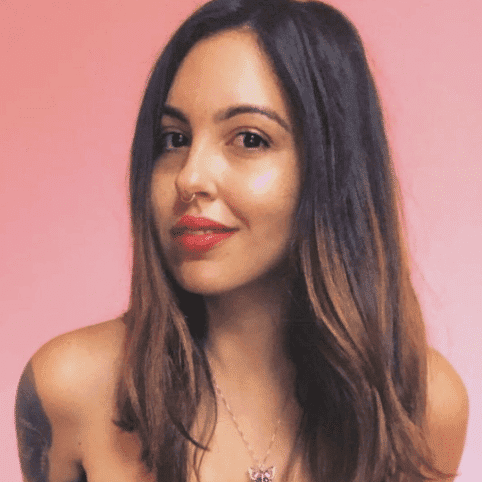 Portrait of ELEANORE, a professional stylist at Fringe Salon NY, showcasing their expertise and style.