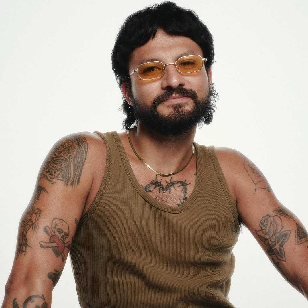 Portrait of ESME, a professional stylist at Fringe Salon NY, showcasing their expertise and style.