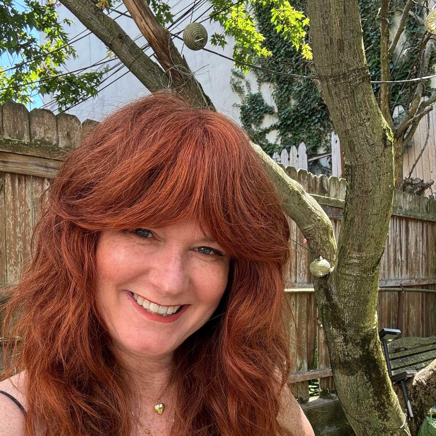 Portrait of MICHELLE CASINO, a professional stylist at Fringe Salon NY, showcasing their expertise and style.